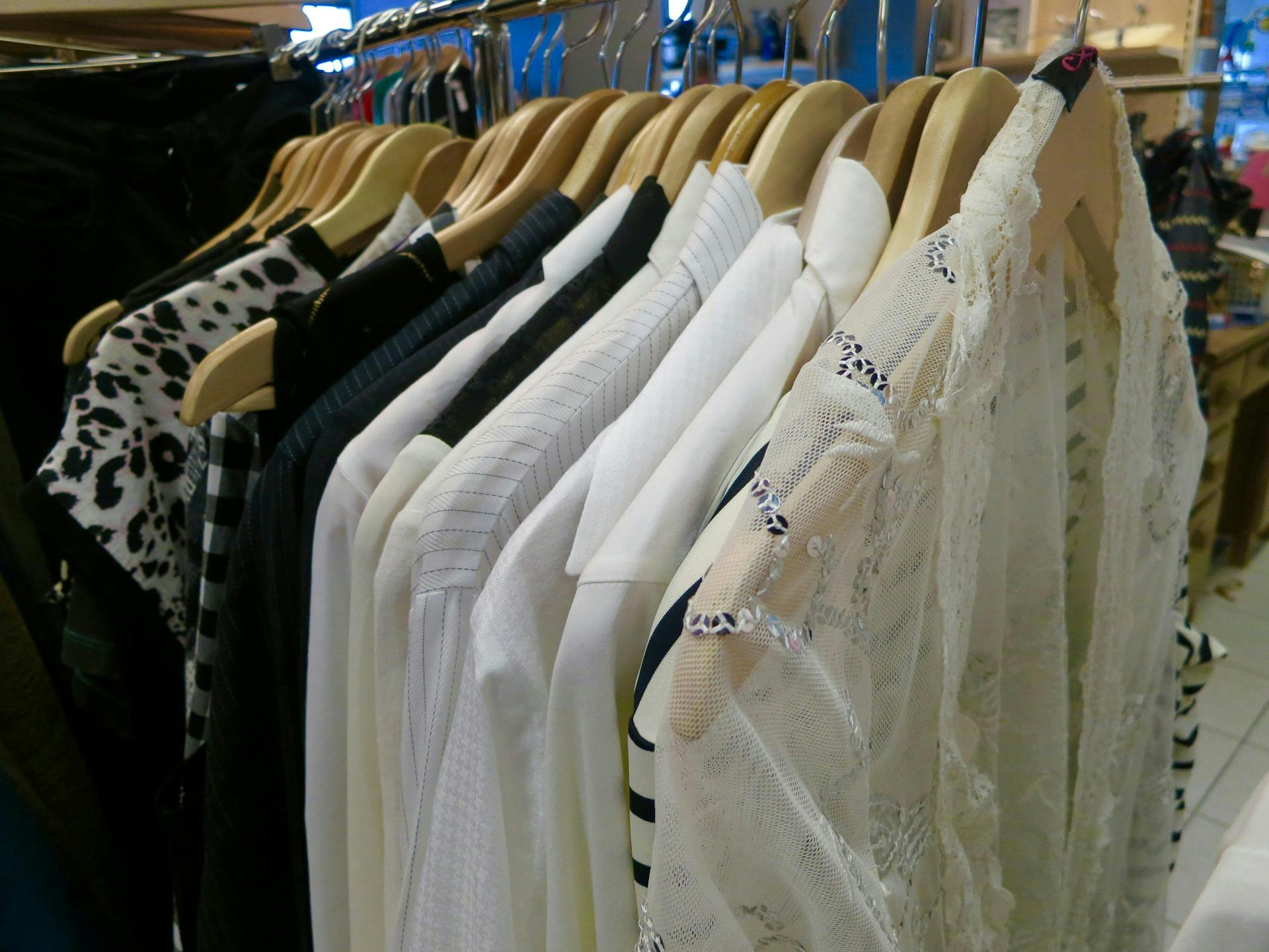 White clothes hanging on a rack. 