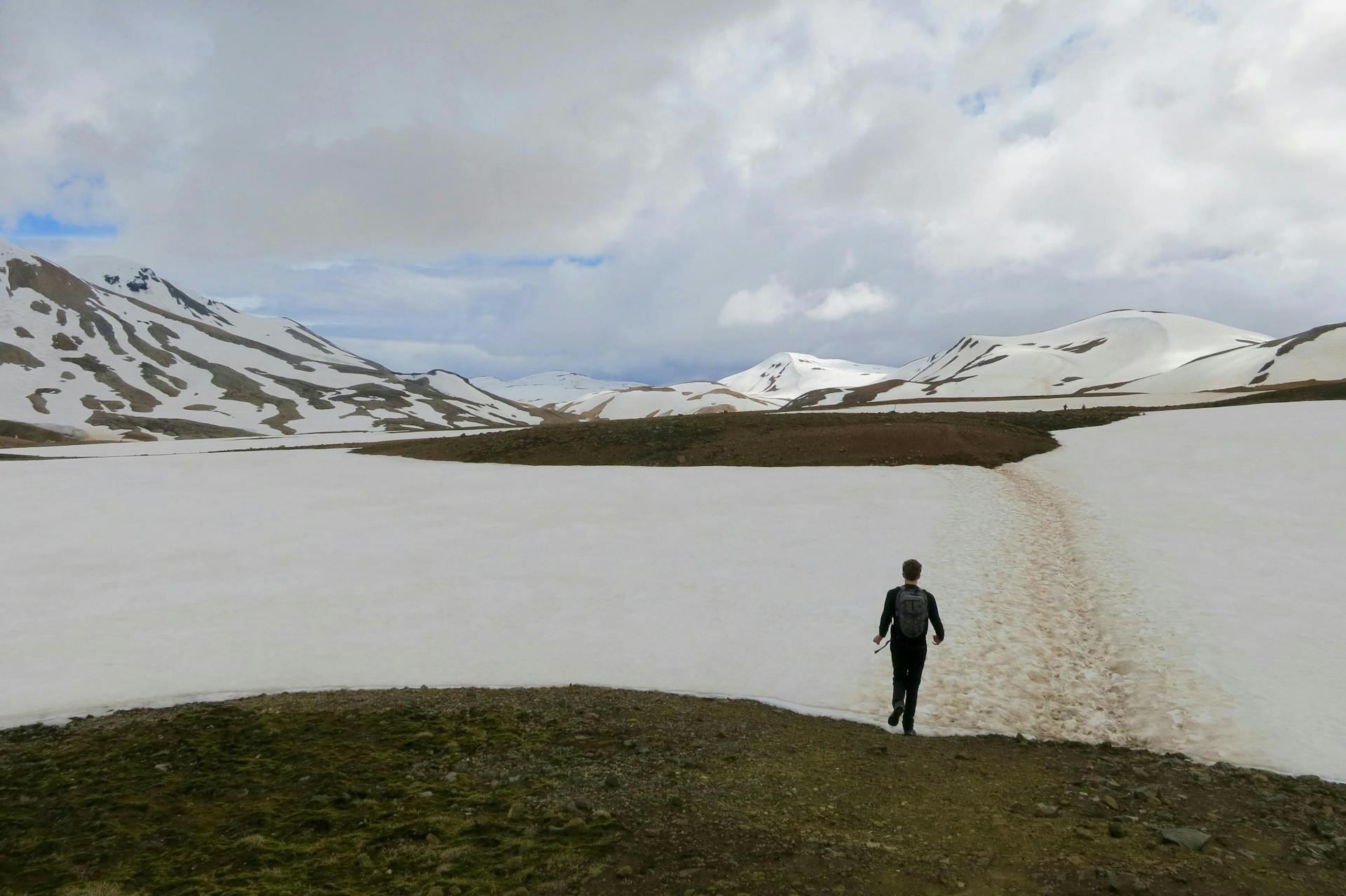 A man hiking near Hveradalir, Kerlingarfjöll, Iceland. 