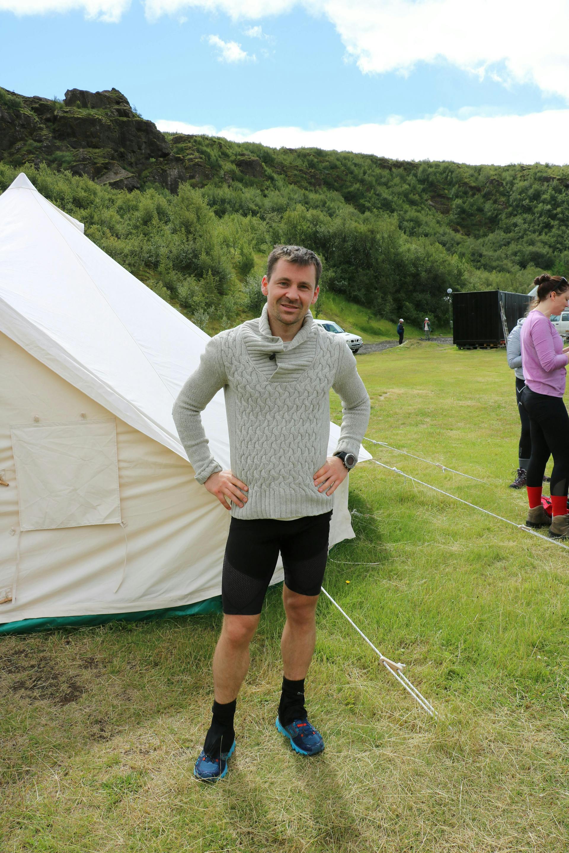 A man by a tent in Thorksmork Valley. 