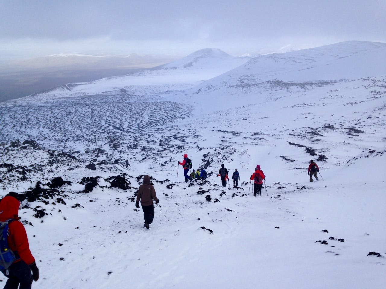 A group of hikers descending Mt. Hekla. 