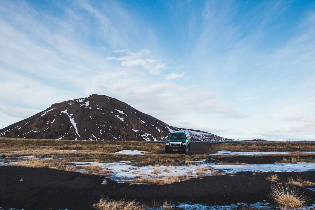 Our super jeep parked in front of a mountain near Lake Myvatn