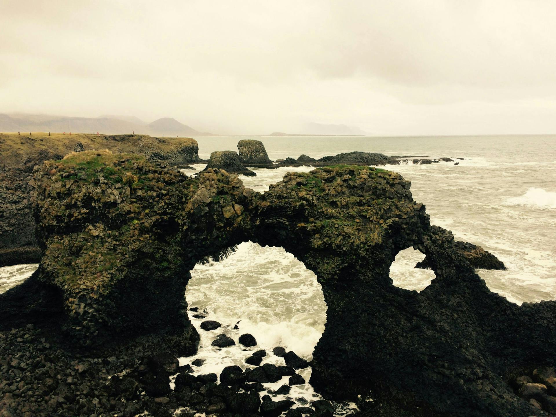 A lava arch by the ocean at Arnarstapi, Iceland. 