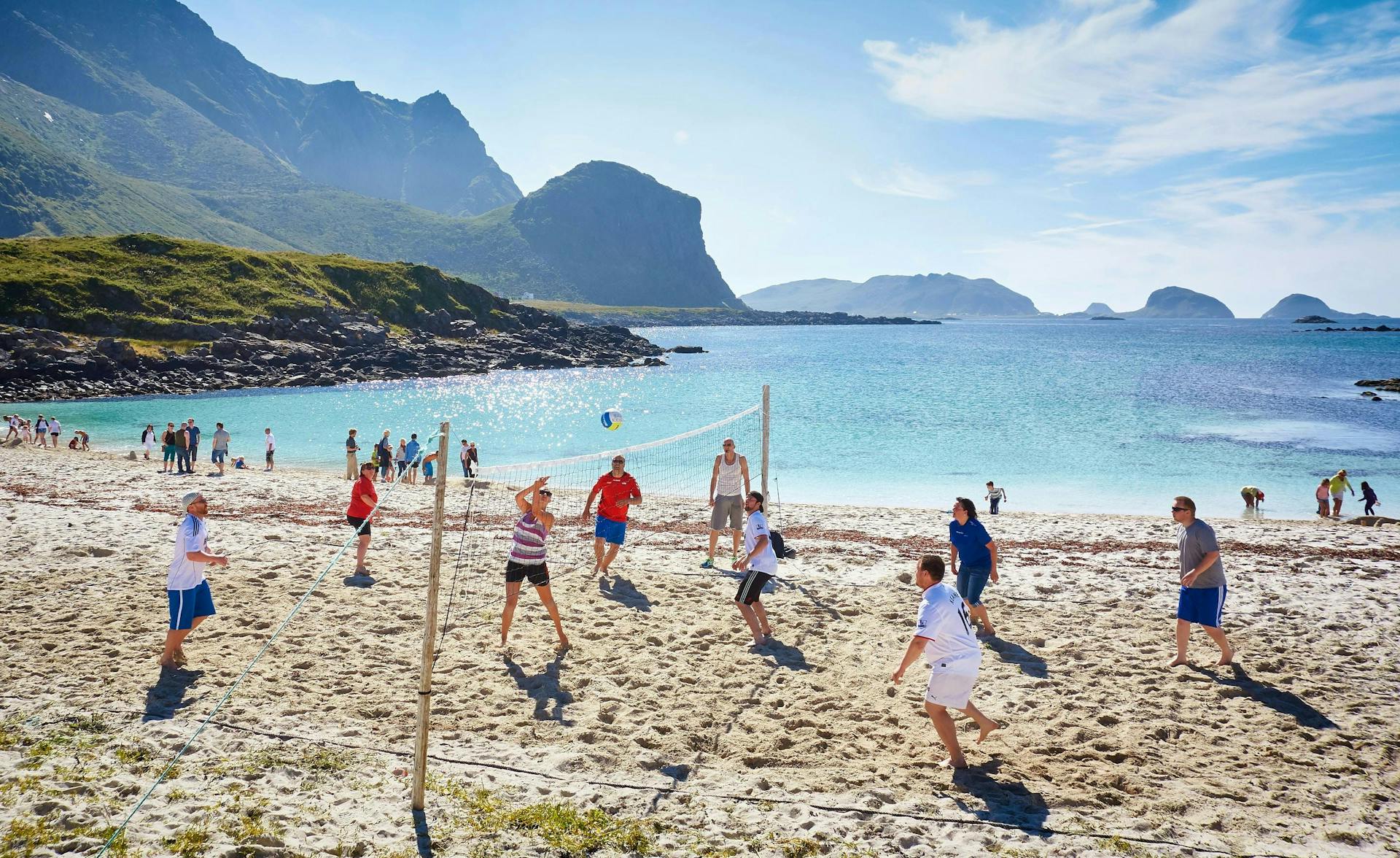People playing beach volleyball in Hovden on a very sunny day. 