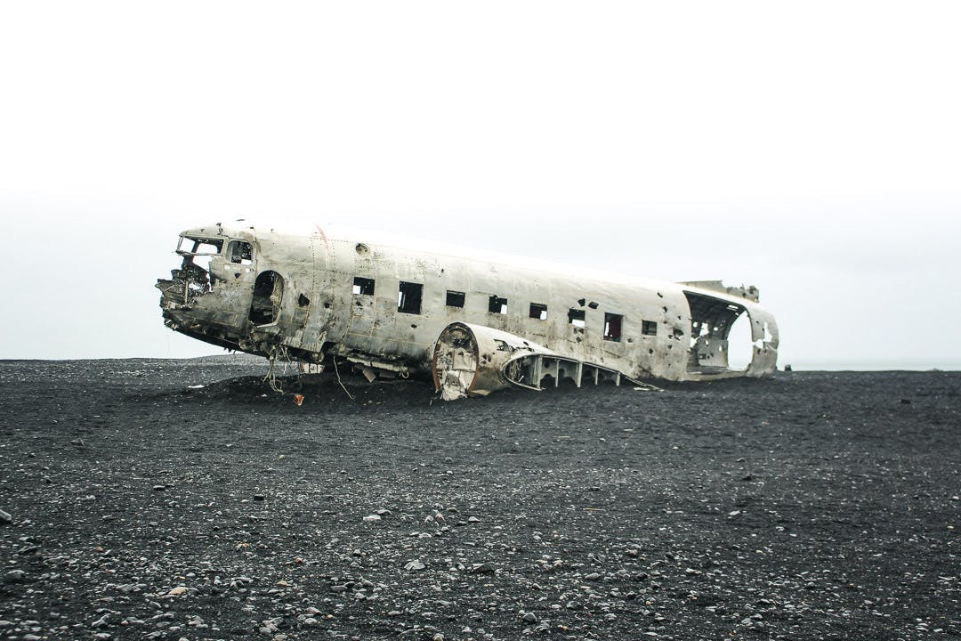 Wrecked plane on the Icelandic black sand beach