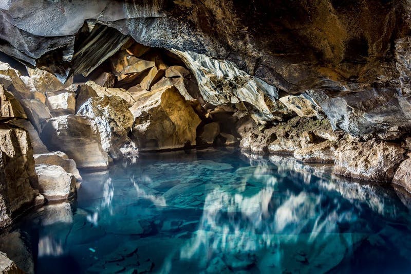 A pool of water inside a cave. 