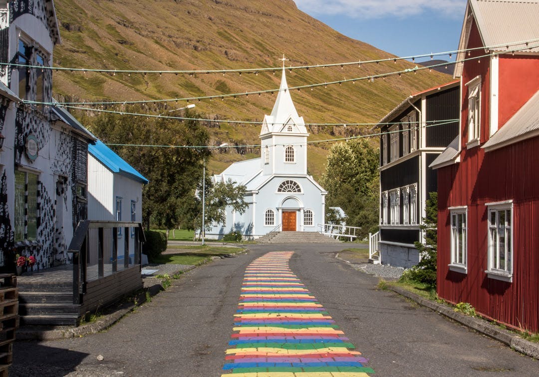 Colourful road leading to a church in Seydisfjordur, East Iceland