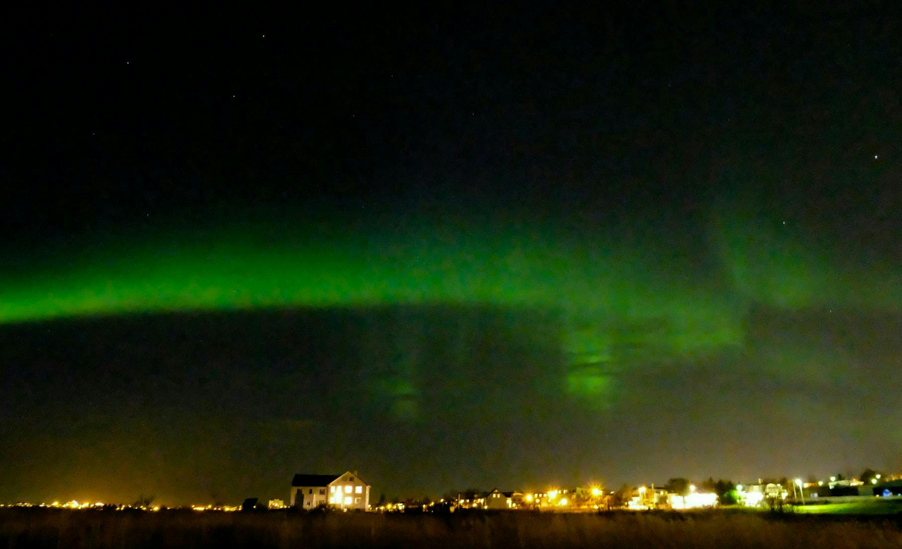 Aurora over house in Reykjavik