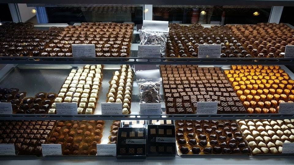 A large number of small chocolates on display. 