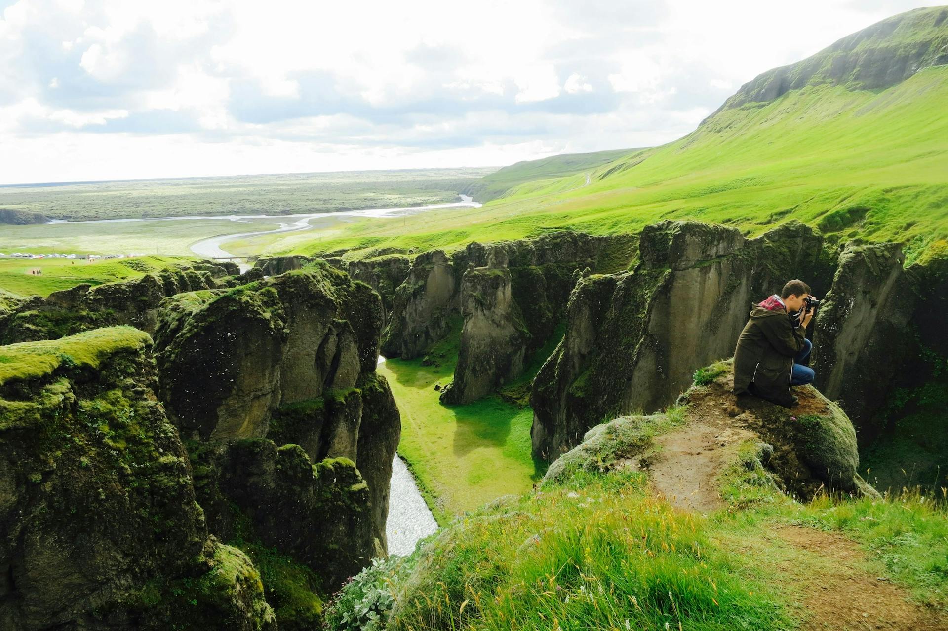 A photographer in Fjaðrárgljúfur canyon, Iceland. 