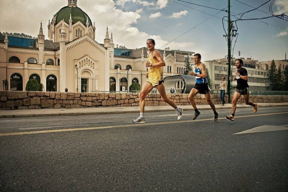 Three runners on the street. 