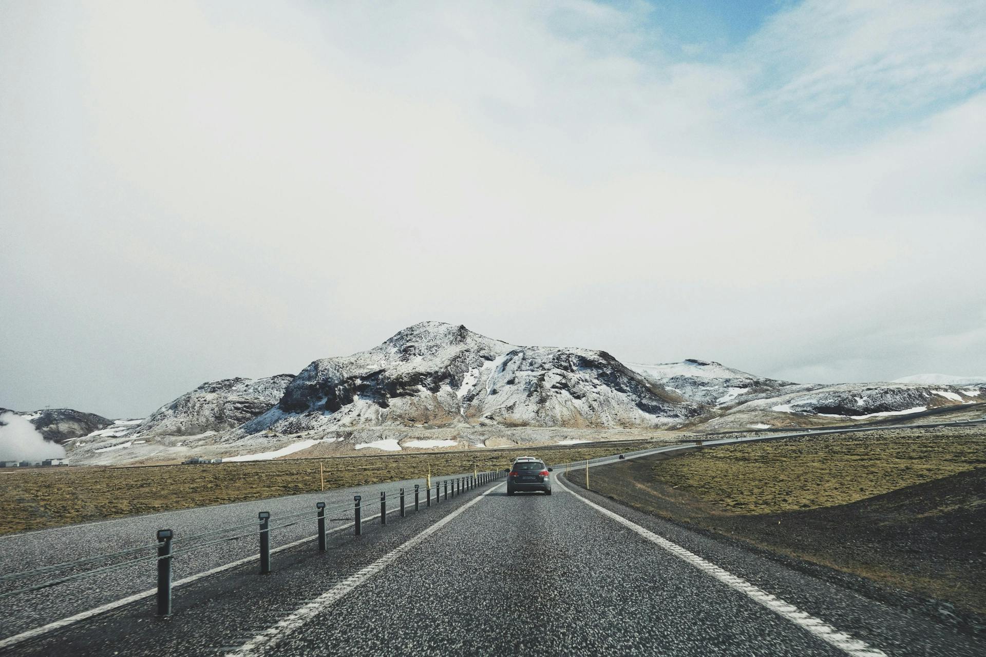 Snowy mountains and a road in Iceland. 