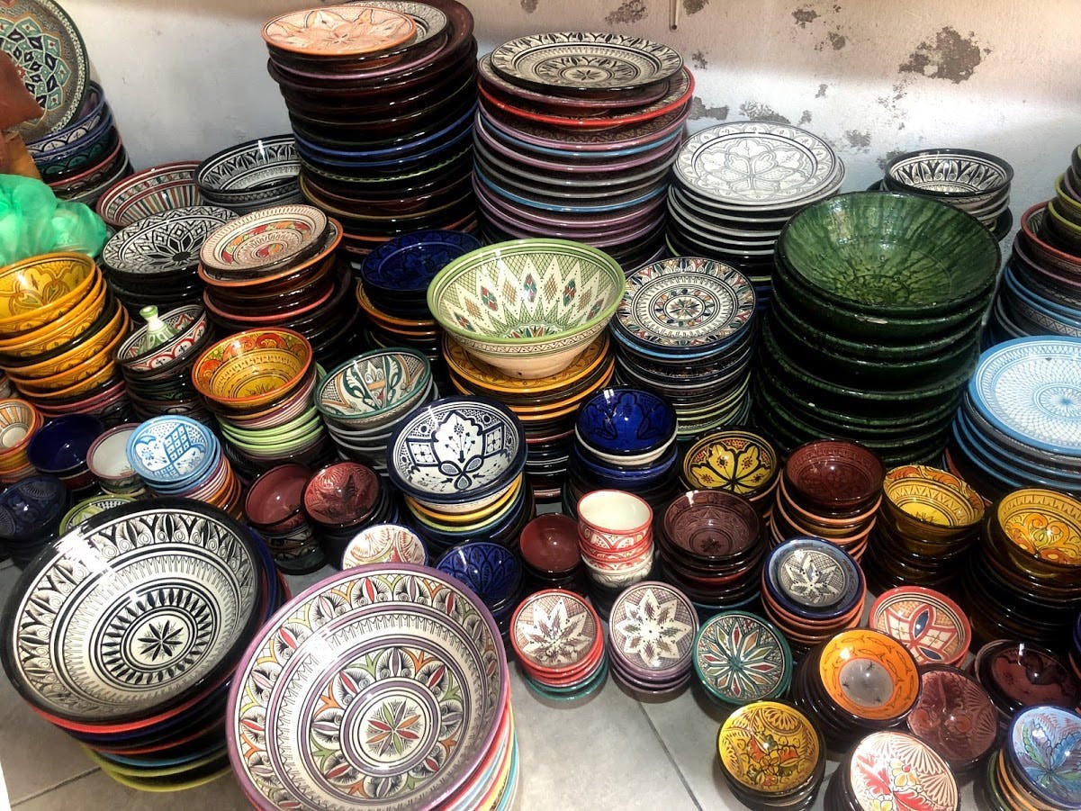 Painted terracotta bowls in stacks. 